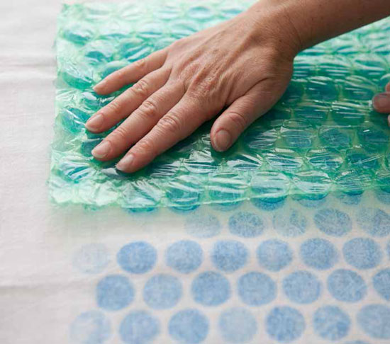 Tap the ink pad over the surface of the bubble wrap until well inked.